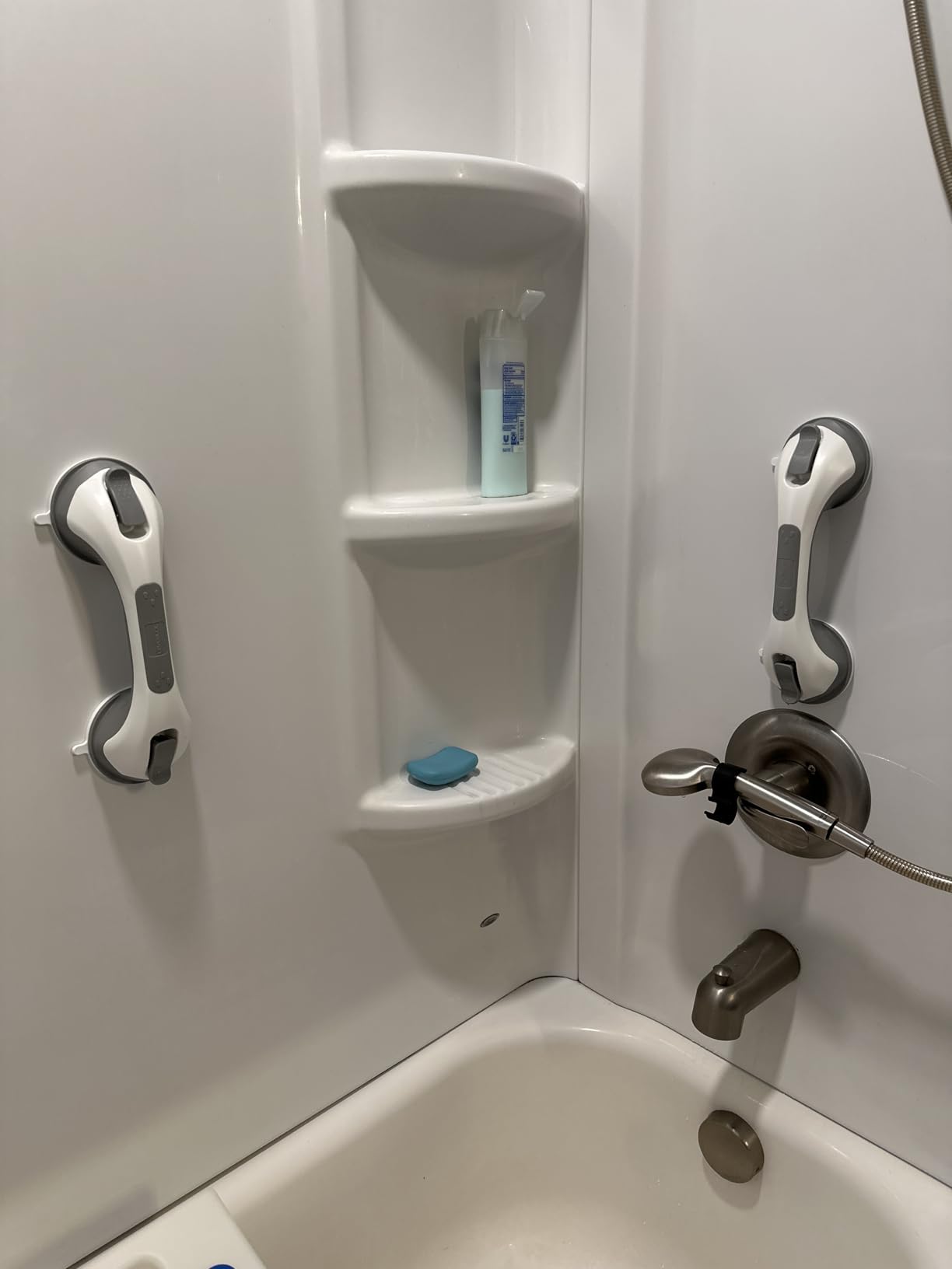 Two grab bars installed in bathtub