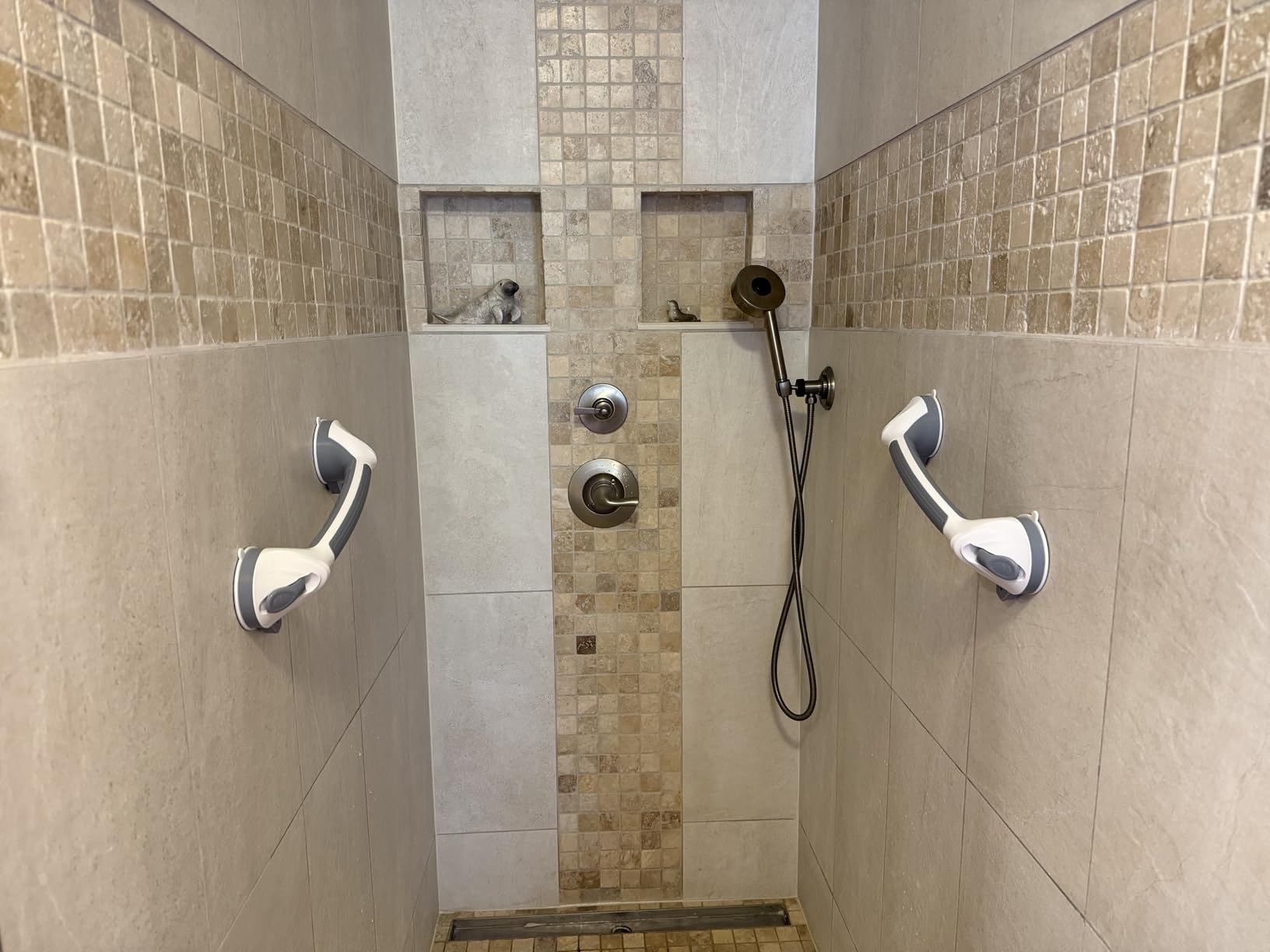 Two grab bars installed in walk-in shower