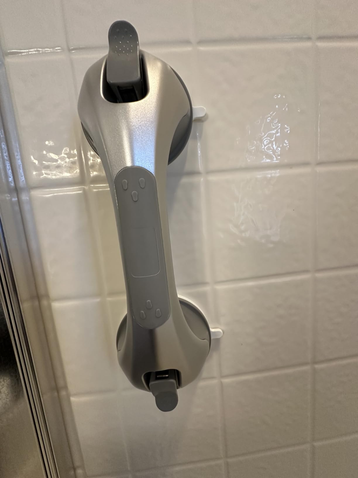 Grab bar installed on bathtub wall